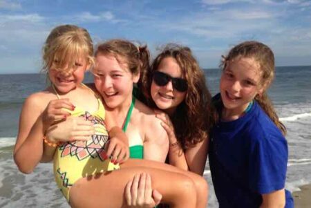 four girls on a beach