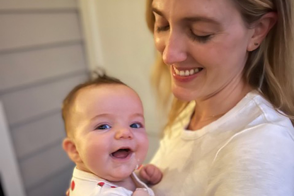 Dr. Sager smiling at her daughter after breastfeeding