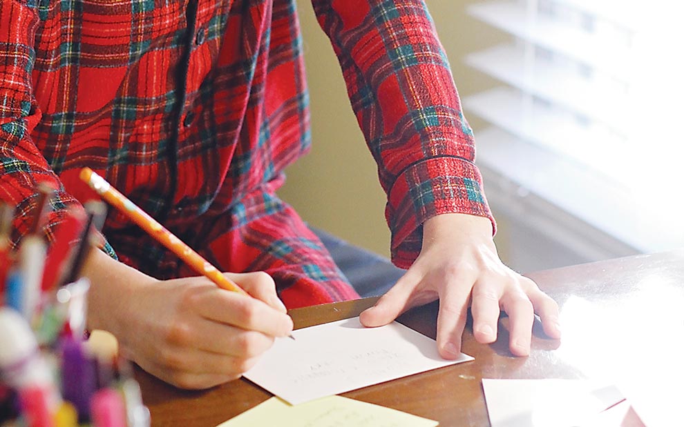 Child writing thank you card