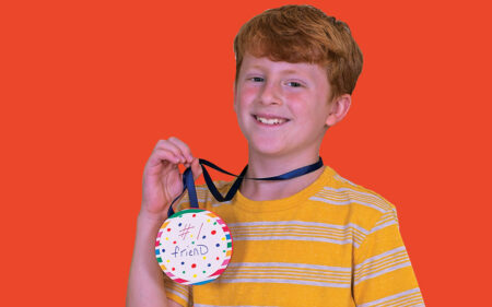 boy with craft medal
