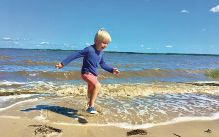 boy running on beach