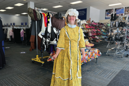 girl at Goodwill in Halloween costume