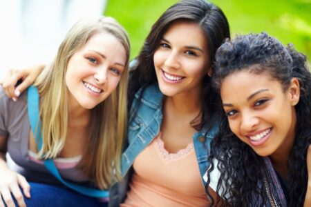 Three friends/teen girls acsmiling