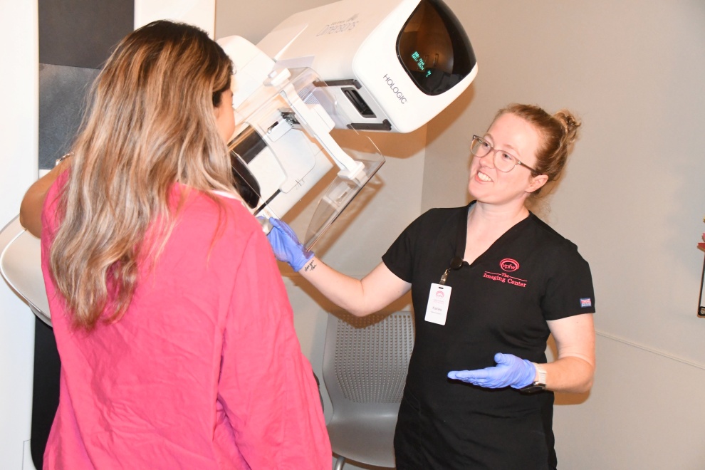 What Is Triple Negative Breast Cancer and Why Is It Harder to Treat? Karlee giving Karla a mammogram talking it through VPFW