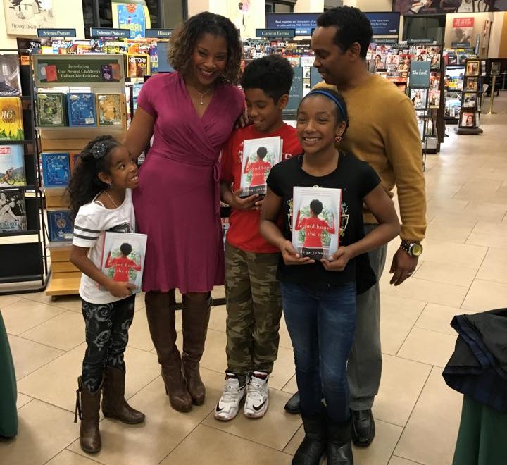 Sadeqa Johnson with family in a bookstore