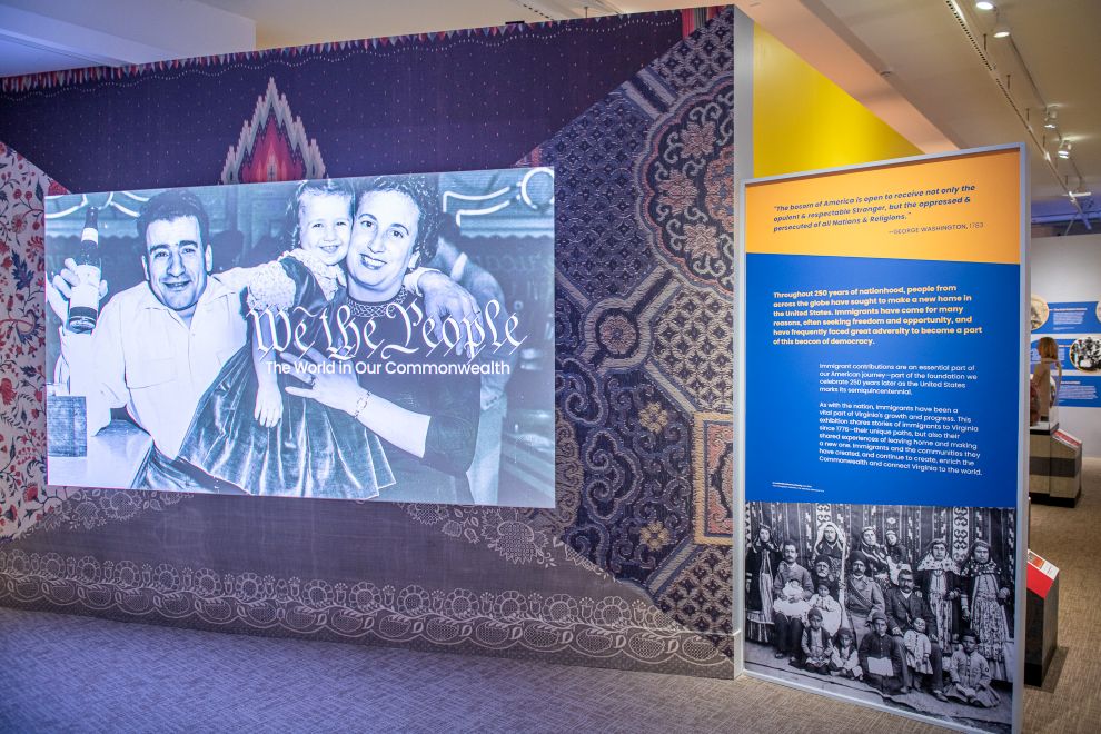 VMHC_We The People_Title Screen with Couple on Video Display_Courtesy of VMHC