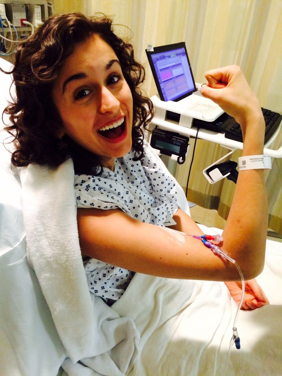 Gabi Day in the Hospital flexing her muscle and looking happy