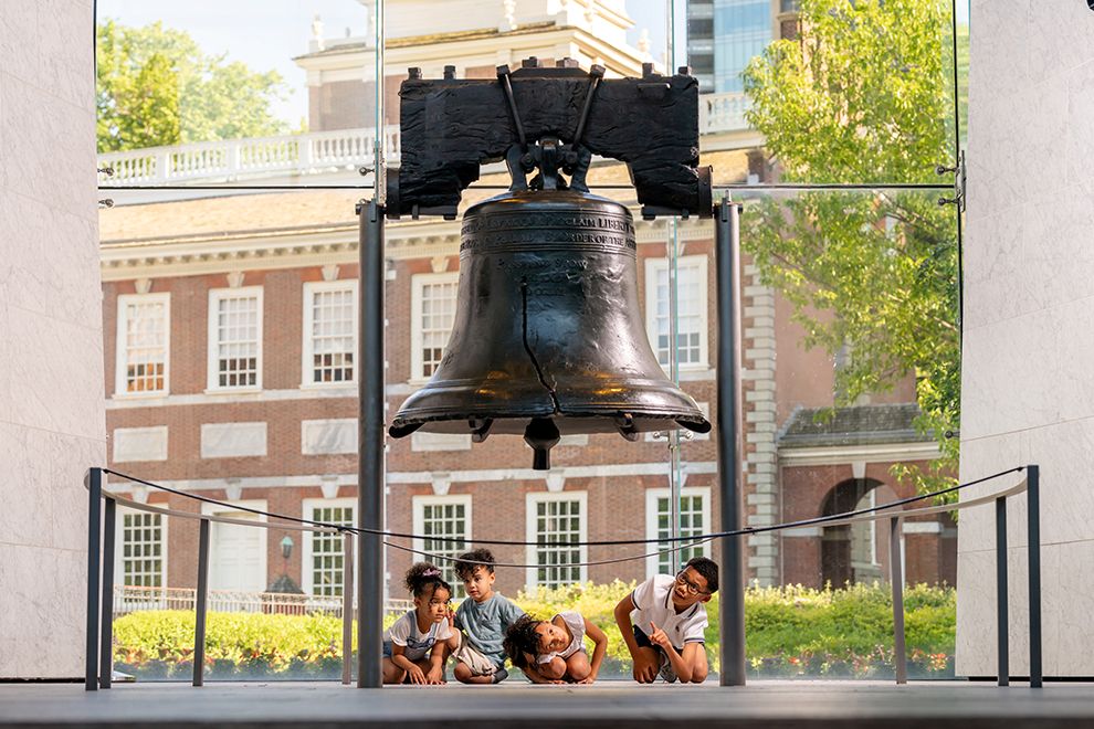 a group of kids looking at the Liberty Bell in Philadelphia PA