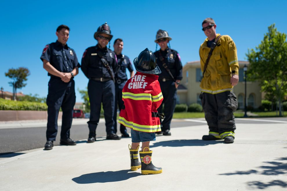 Photo by Hamza El-Falah on Unsplash child with firefighters