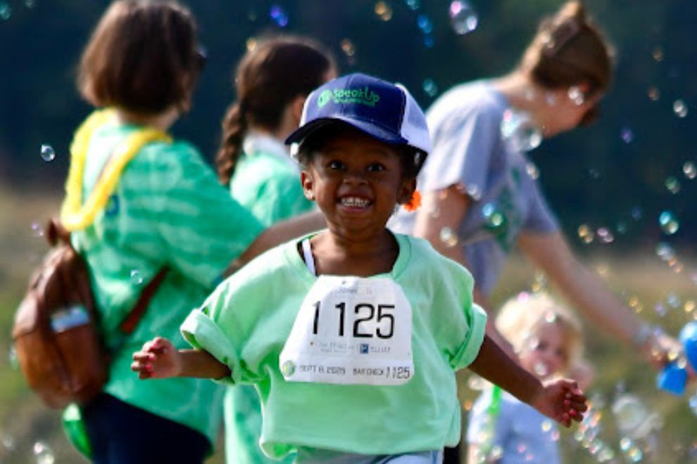 Speak UP 5K CKG Foundation child running through bubbles