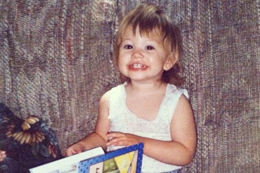 Lifelong Learning Christine St Peter with a book when she was a small child
