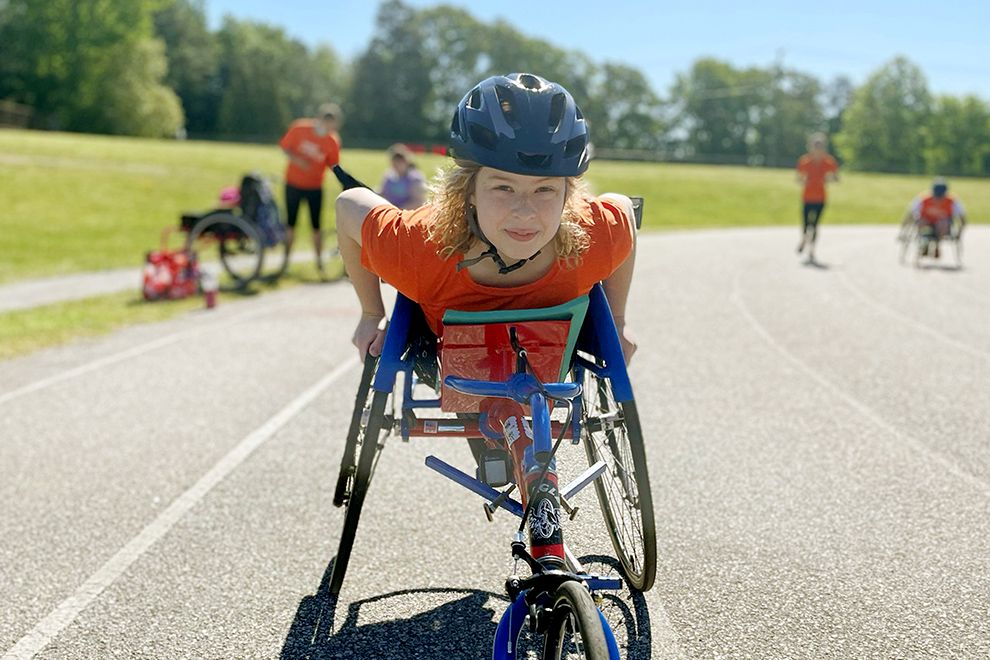 girl on a track in a wheelchair - adaptive sports - Sportable