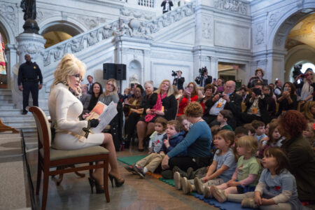 Dolly Parton reads "Coat of Many Colors," the one hundred millionth book donated by Parton's nonprofit Imagination Library, during a ceremony in the Great Hall, February 27, 2018.