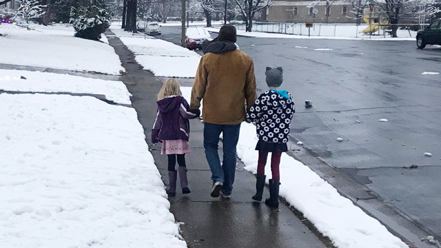 Dad and kids walking in winter