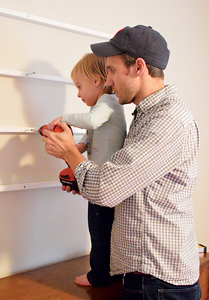 John and Clara work on a DIY project that might be featured on the Petersiks’ wildly popular blog, Young House Love.