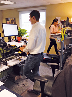 At the Sports Backers office, employees work at and walk on  treadmill desks and also use adjustable sit-to-stand workstations.