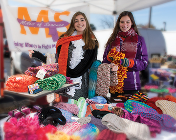 Meredith Polk, right, is shown here with Emily Harrison, a fellow philanthropist. The efforts of Miles of Scarves, founded by Meredith, have resulted in more than $22,000 for MS.